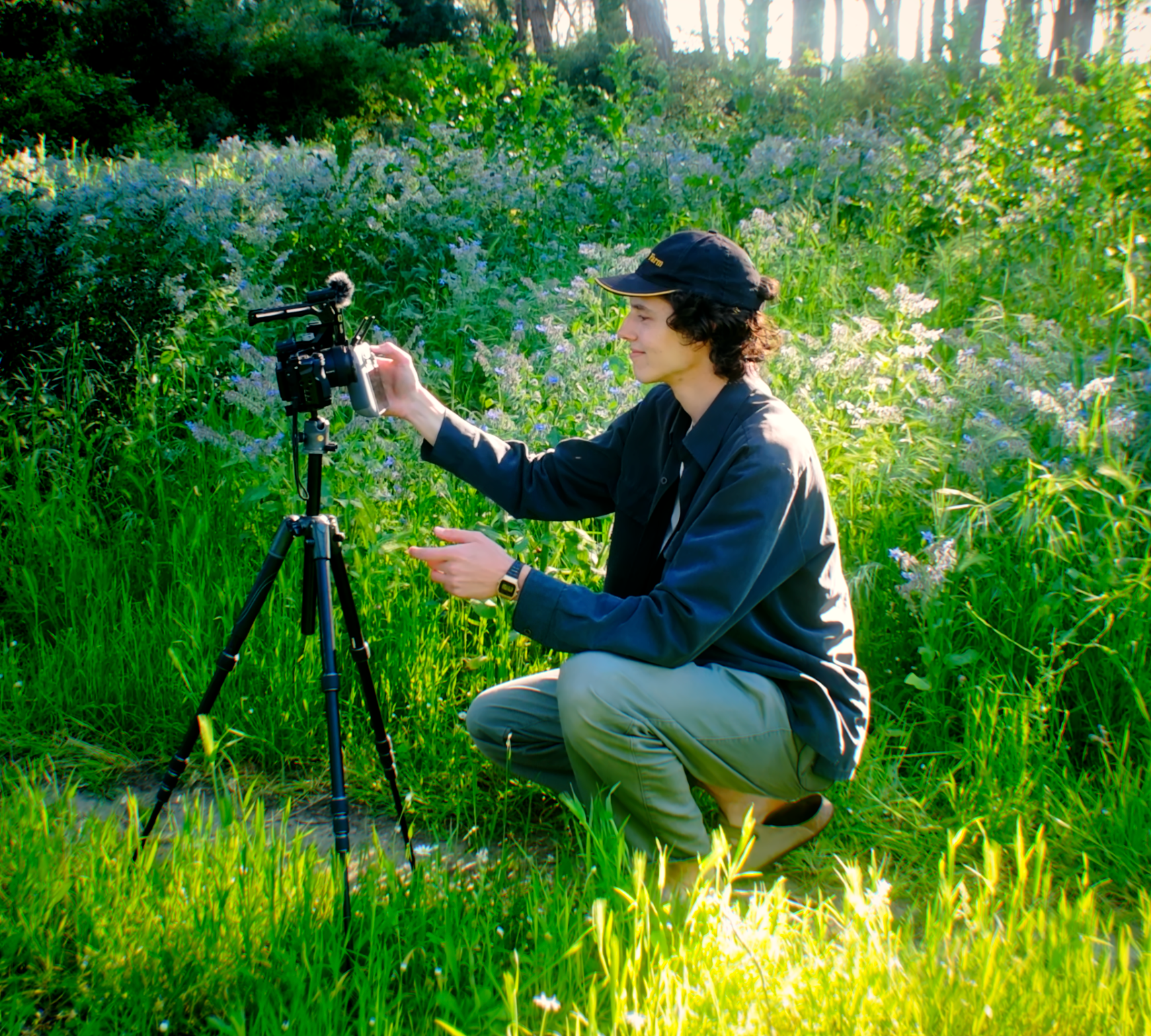 Seb taking a camera selfie in the garden