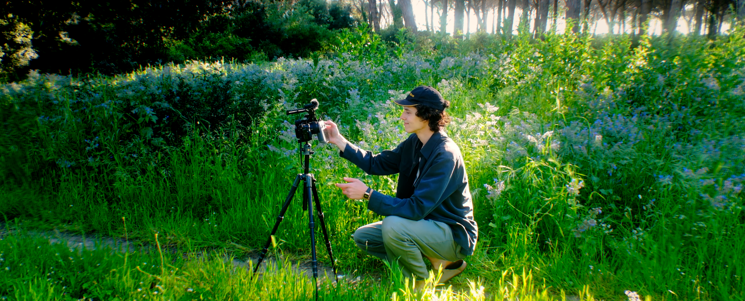Seb filming in a garden